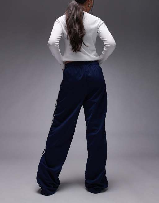 adidas Originals Firebird loose track pants in navy and white