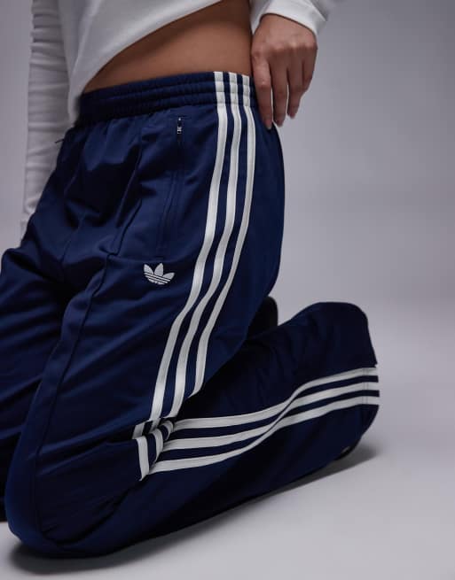 adidas Originals Firebird loose track pants in navy and white